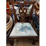 A 19th Century mahogany framed Chippendale style nursing chair with upholstered drop-in seat, set on