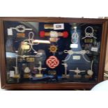 A modern wall mounted case containing a nautical knot display