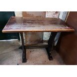 A 91cm vintage stained oak refectory style tavern table, set on shaped standard ends with pegged