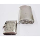 A silver vesta case of oval form - sold with a silver traditional fob vesta case with engraved