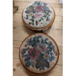 A pair of Victorian mahogany and strung circular foot stools with bead-work floral sprays to