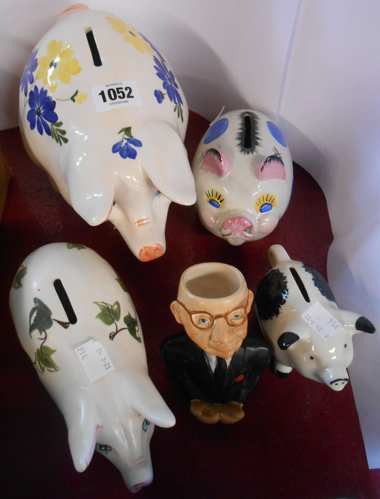 A small quantity of ceramic items comprising Babbacombe pottery piggy bank, three other similar
