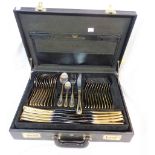 A black attache case containing a twelve place setting of SBS (Solengen) German silver plated