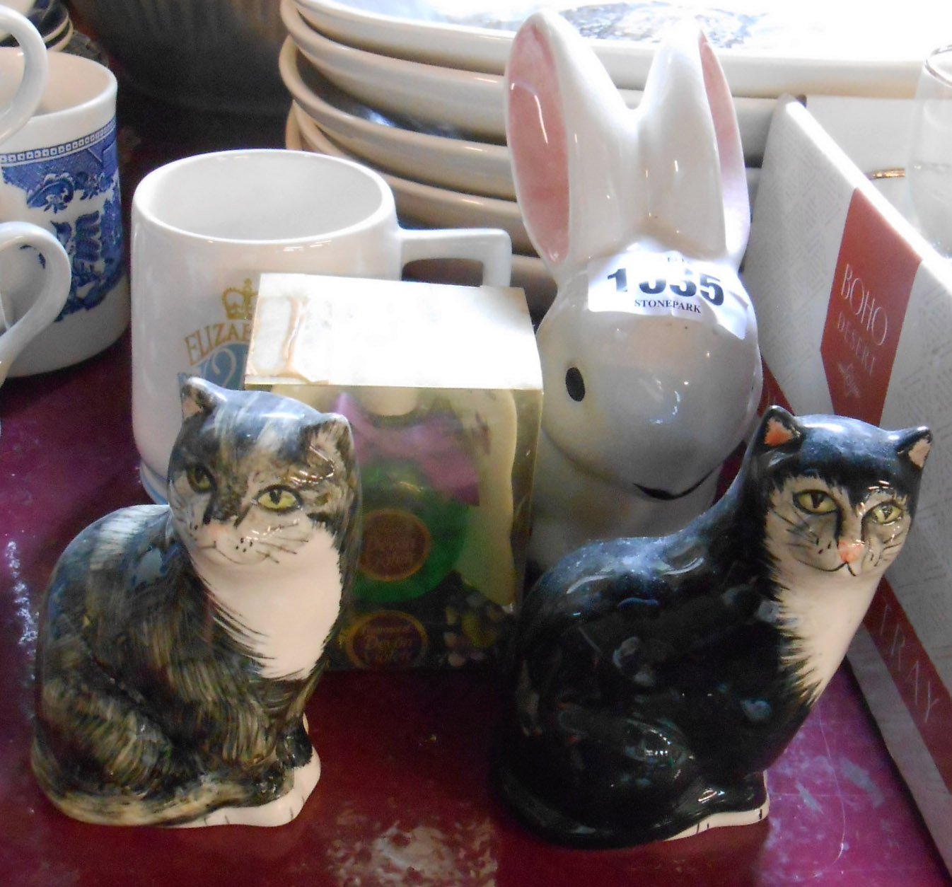 A small quantity of West Country pottery comprising two small Babbacombe pottery cats, a Toni