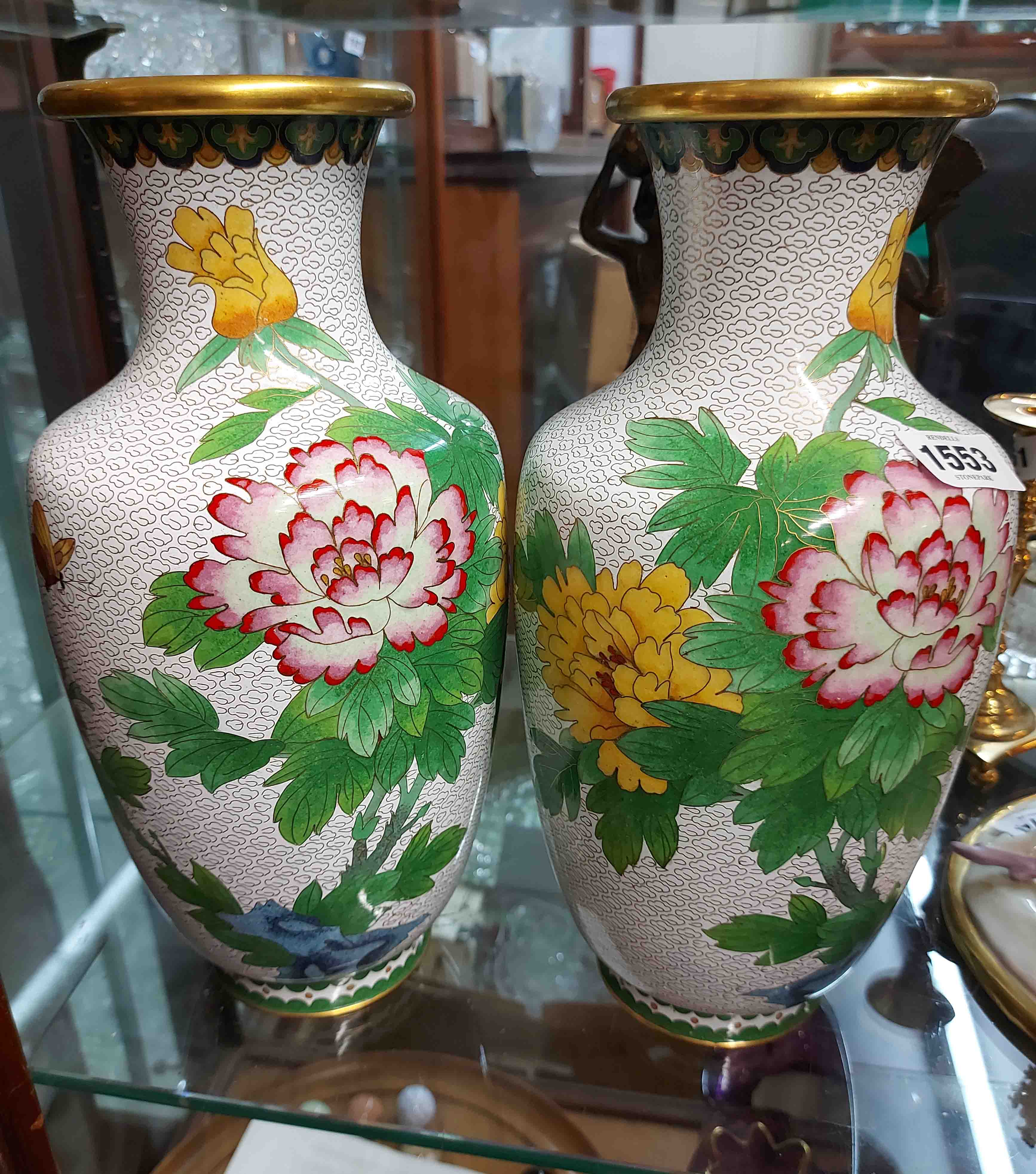 A pair of late 20th Century Chinese cloisonne vases of baluster form with bold floral sprays and