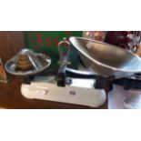 A set of vintage Avery scales with enamel base, metal pans and set of graduated brass weights