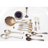 A bag containing a quantity of small silver and white metal cutlery, also a large decorative spoon