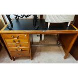A 1.21m vintage stained mixed wood single pedestal desk with inset top and flight of five pedestal