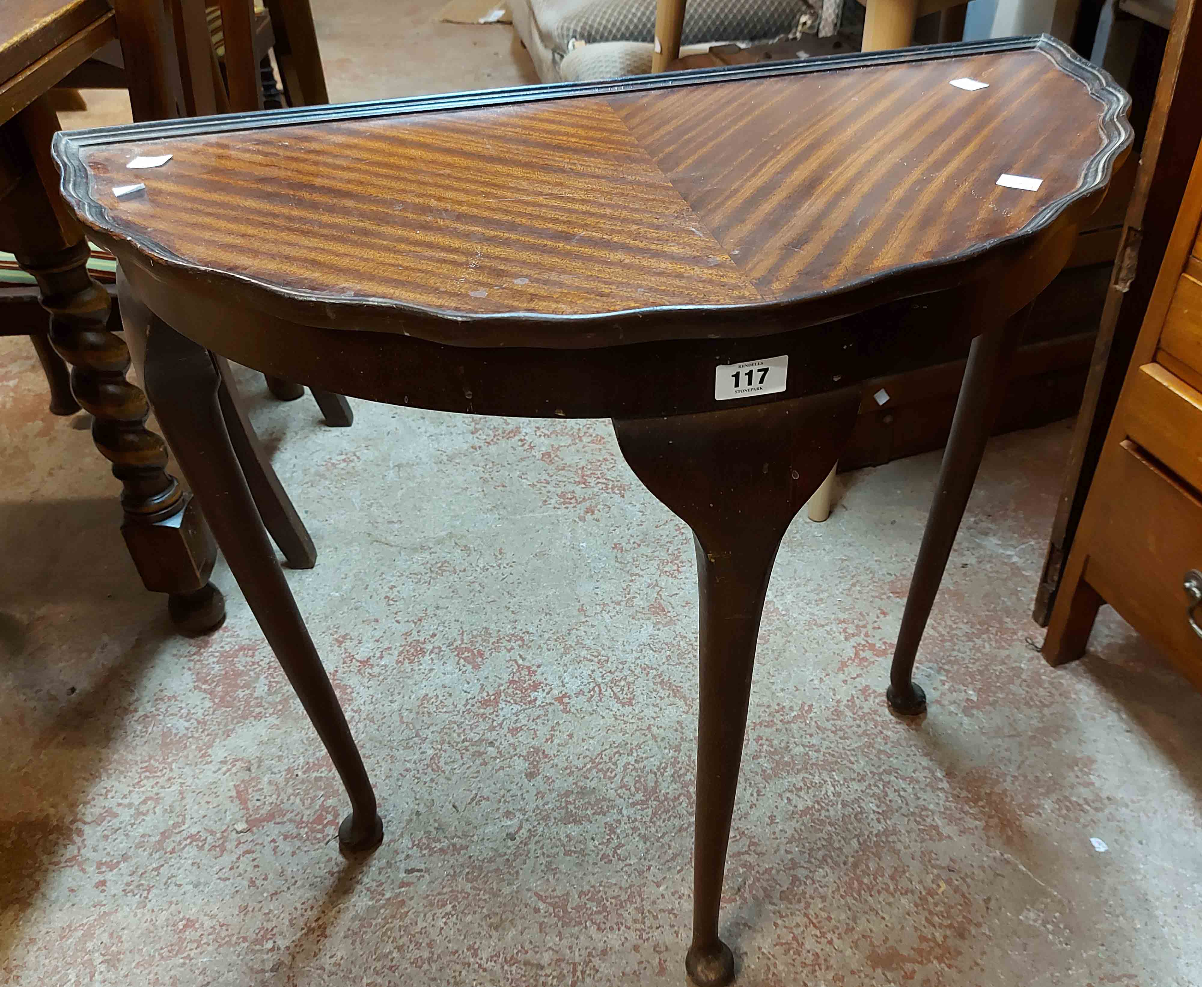 A 74cm modern mixed wood demi-lune side table, set on triple cabriole legs