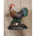 A modern painted cast iron cockerel pattern door stop