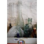 A box containing a quantity of old glass bottles including Dalkeith, Heinr Kamp Port Elizabeth