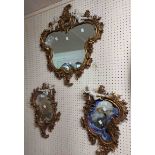 Three reproduction ornate Rococo style wall mirrors comprising a pair of side mirrors and larger