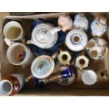 A box containing a quantity of assorted ceramic items including crested china, German nodding
