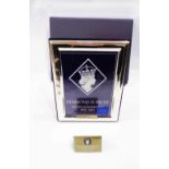 A 2012 commemorative silver fronted photograph frame with large hallmarks to border and