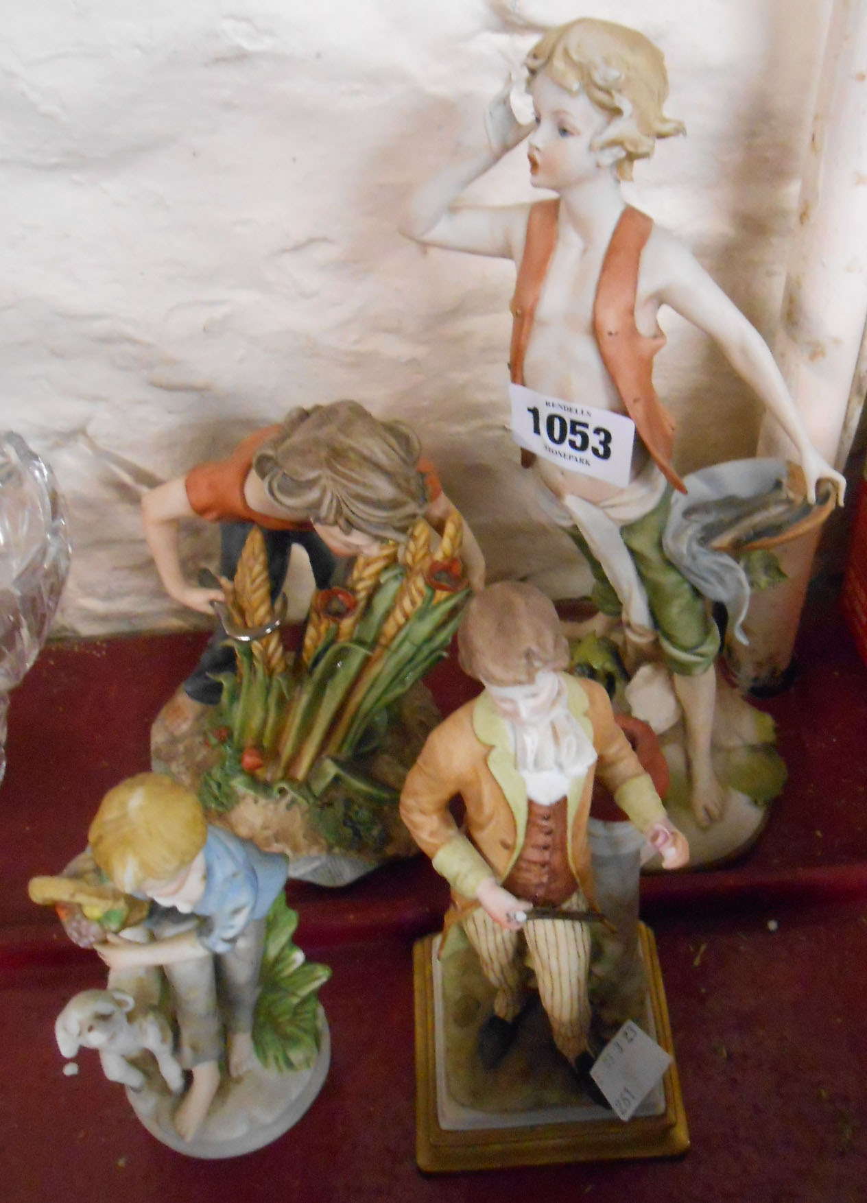 Three Capodimonte figurines - sold with another similar - various condition