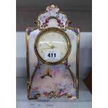 A Bradford Exchange limited edition ornate porcelain cased timepiece 'Garden Whispers', with