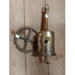 An antique brass clockwork spit jack with spit wheel and brass plaque label marked John Linwood