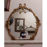 A modern gilt framed oval wall mirror in the antique style - sold with a modern bevelled oblong wall