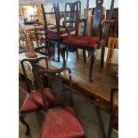 A set of six old mahogany framed Queen Anne style dining chairs comprising four standard and two