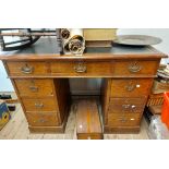 A 1.06m late Victorian pitch pine twin pedestal desk with green leather inset top, three frieze