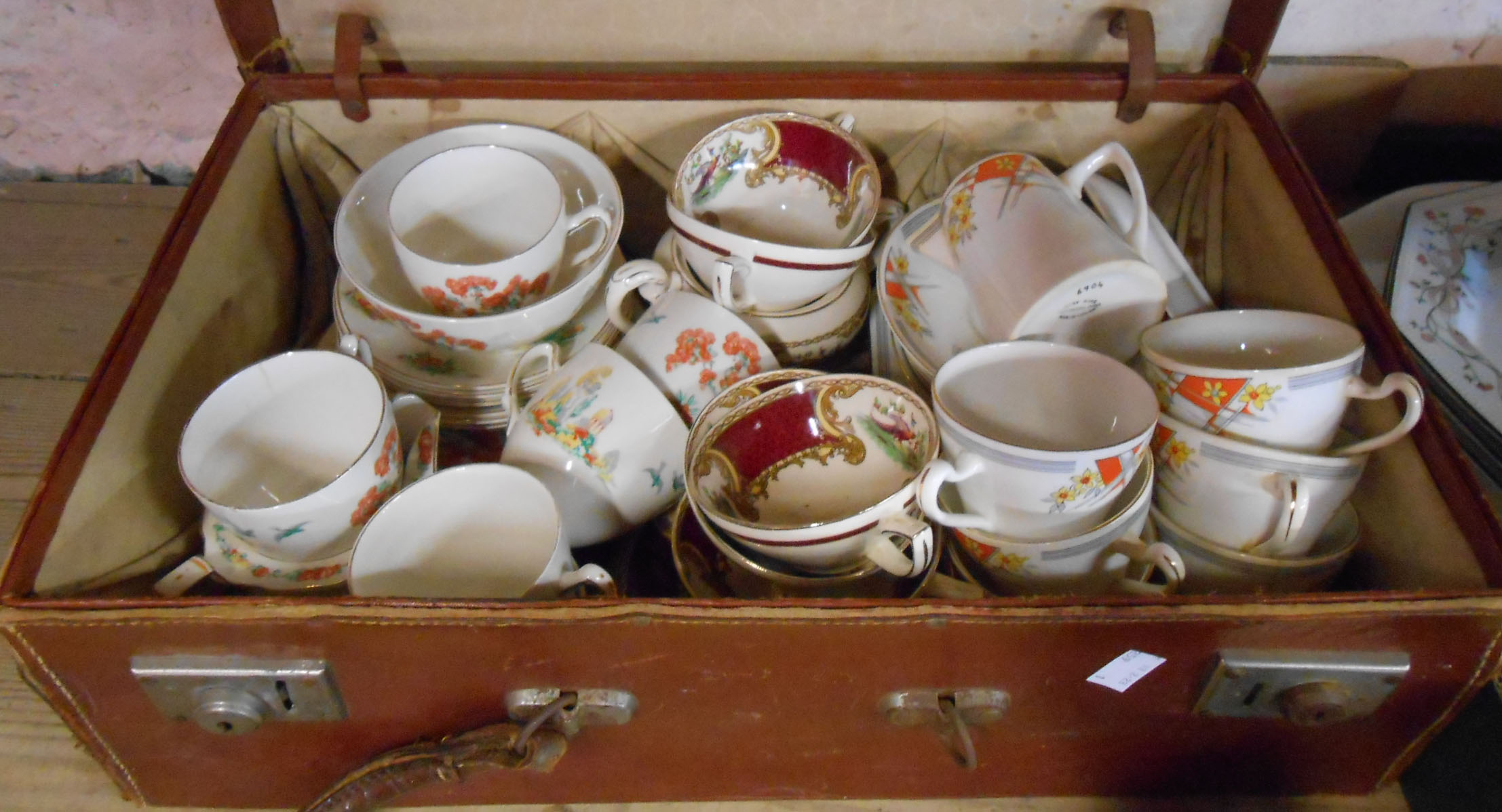 A Grindley pottery part tea set, a Myott pottery similar and a Heathcote bone china part tea set