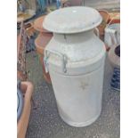 A vintage aluminium two handled milk churn with lid - made by Grundy (Teddington)