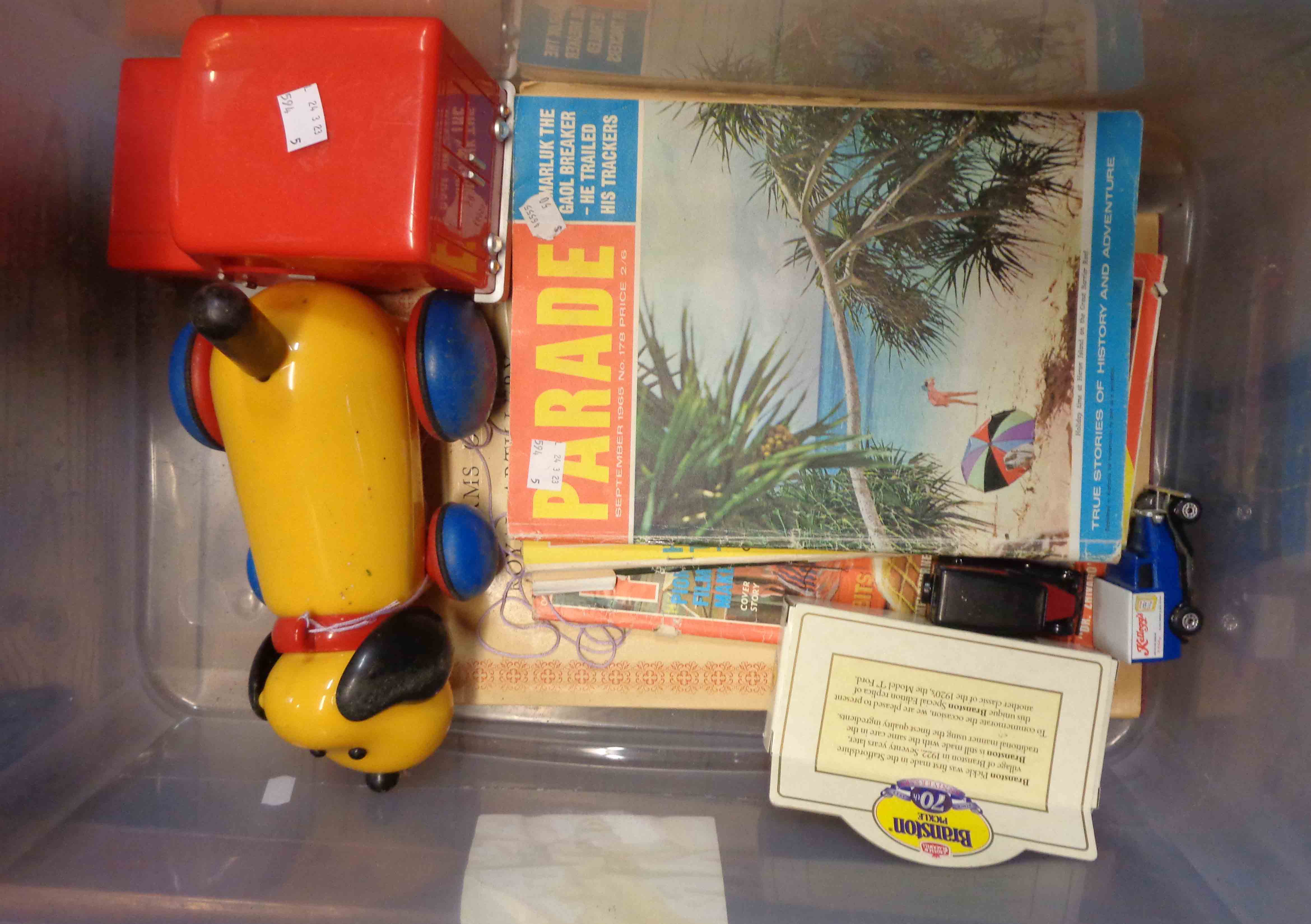 A crate containing a small quantity of collectable items including child's Postman Pat toy van,