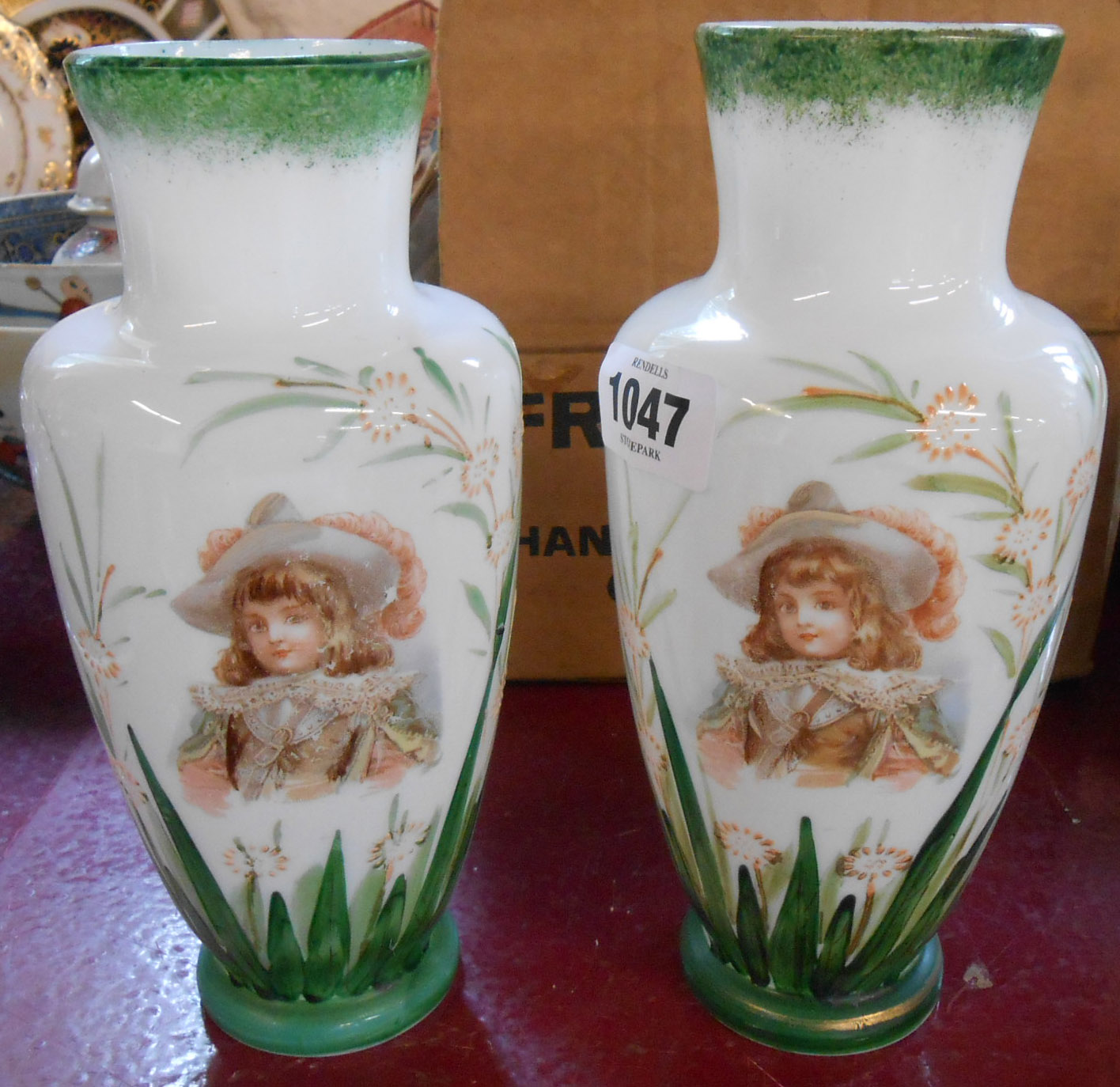 A pair of Victorian milk glass vases with central transfer printed panels depicting a young man in