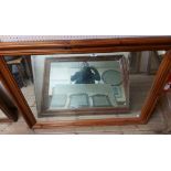 A modern stained pine framed oblong wall mirror - 1.22m X 93cm