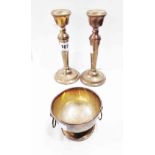 A pair of 18cm high silver candlesticks with loaded circular bases - sold with a small silver footed