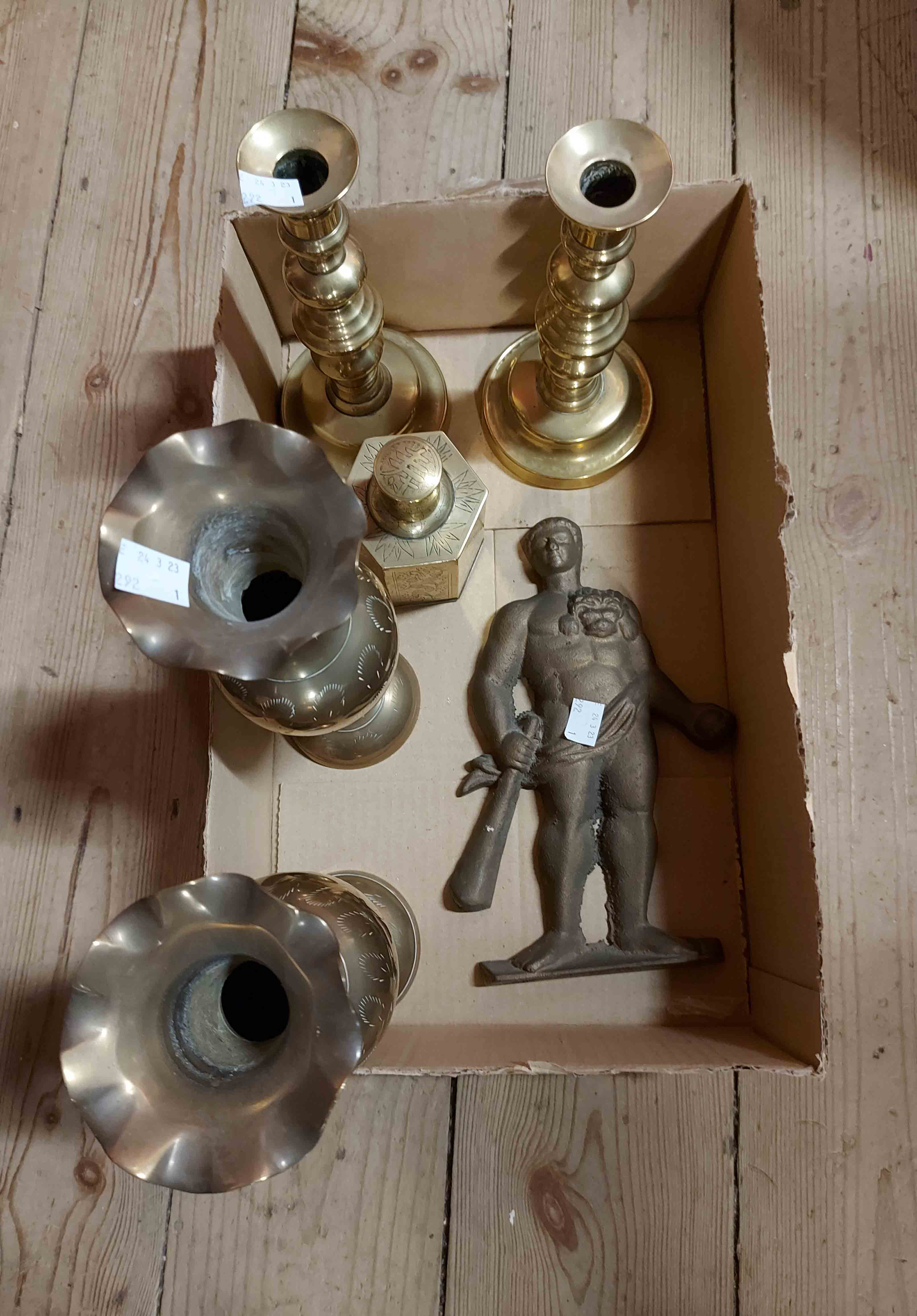 A small box containing a quantity of assorted brassware including Victorian candlesticks, Chinese