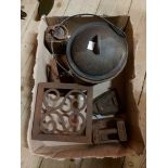 A box containing a quantity of assorted metalware including cast iron trivet, flat irons, weights,