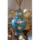 A pottery table lamp of temple jar form with incised decorative scrolls on a blue base ground, set