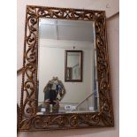 A vintage Aesonia gilt framed bevelled oblong wall mirror with Rococo style pierced scroll
