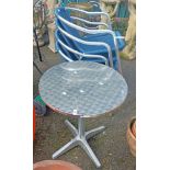 A modern metal circular garden table, set on quatrefoil base - sold with four tubular metal framed