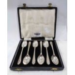 A cased set of six Sheffield silver teaspoons with shaped terminals