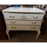 A 79cm modern French style cream painted chest of three long drawers with gilt handles, set on