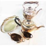 A silver plated spirit kettle on stand with burner - sold with a three piece plated tea set and