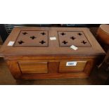 A wooden ecclesiastical pierced lift-top box