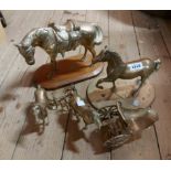 A large cast brass horse figurine set on a wooden plinth and a smaller similar - sold with two