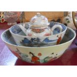 An antique Chinese porcelain famille rose bowl decorated all around with scholars and courtesans