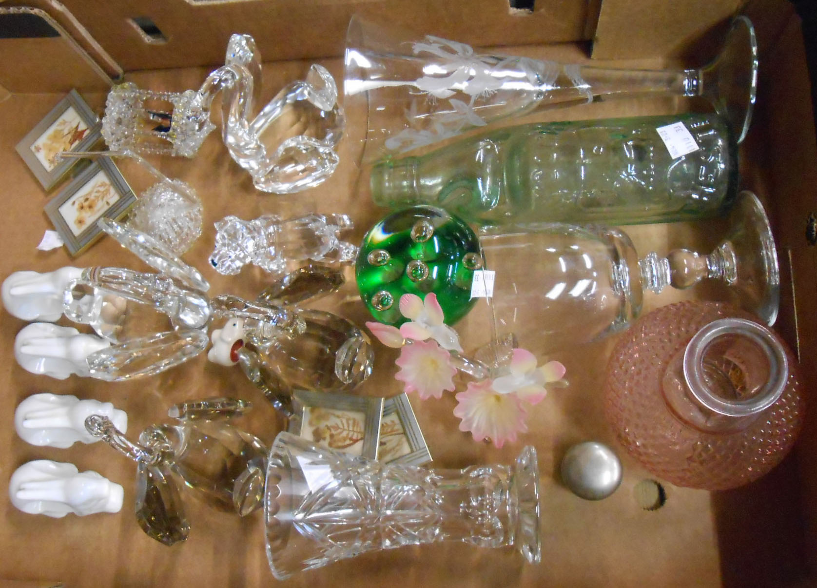 A box containing a quantity of assorted glass and ceramic items including paperweights, drinking