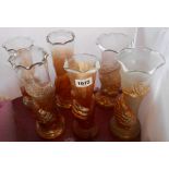 Six unusual Carnival glass vases with marigold, clear and frosted decoration including elephant,