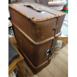 A 70cm old cane bound canvas travelling trunk with internal lift-out tray and flanking leather strap