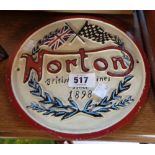 A modern painted cast iron Norton Motorcycles sign