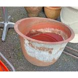 A large old metal wash tub