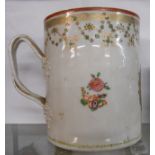 An 18th Century Chinese export porcelain tankard with double strap handle and hand painted floral