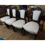 A set of four late Victorian ebonised framed standard chairs by John Taylor & Son of Edinburgh, with