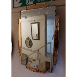 A vintage frameless bevelled oblong wall mirror with peach mirror glass top, bottom and sides