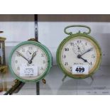 Two vintage painted metal cased alarm clocks, comprising Beatall and Mauthe examples - both a/f